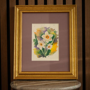 Loose floral watercolor painting of white daffodils with orange centers framed in a lavender mat and a gold frame