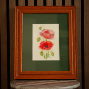 Loose red poppies mixed with purple painting matted in green with a warm wood frame