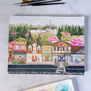 Whimsical painting of downtown Poulsbo WA during the spring with colorful shops, evergreen and blossoming cherry trees, and a white and blue church.